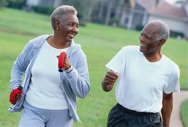 Elderly black couple during brisk walking