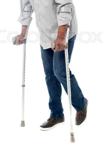 An elderly blackman on crutches