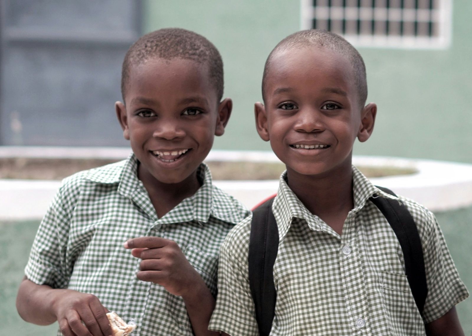 Two African children of school age standing togerther