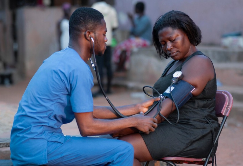 A young African lady having blood pressure check