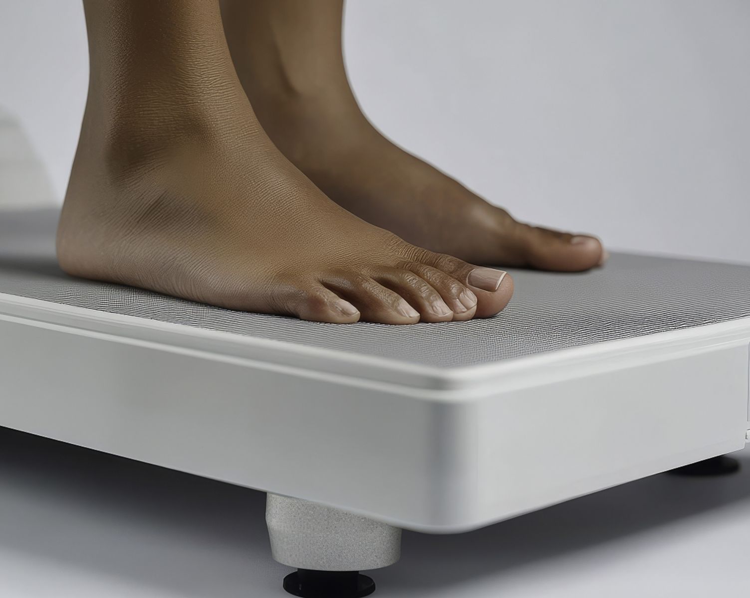 Black feet on a weighing scale