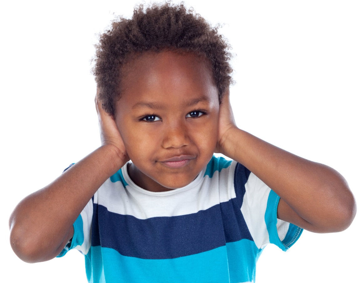 Black child with hands covering both ears
